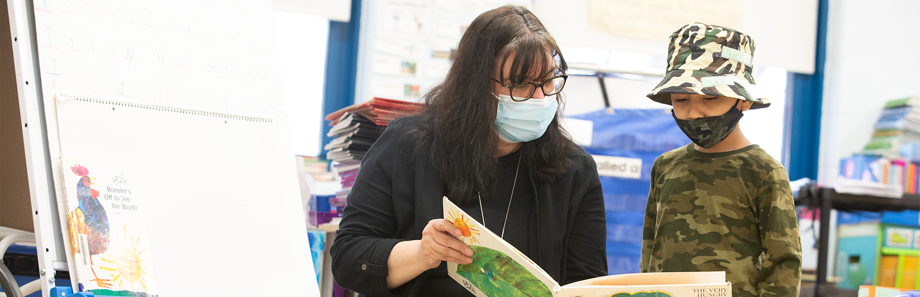 Teacher reading to student